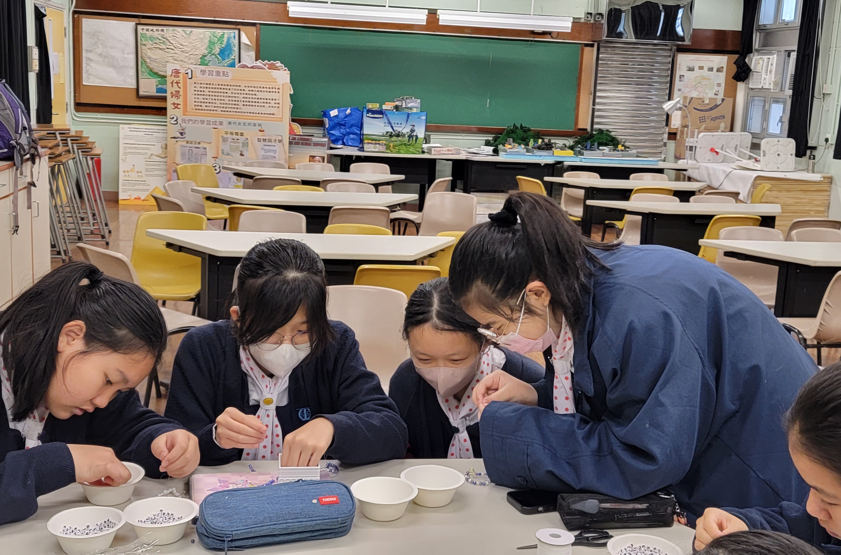 A group of students in a classroomDescription automatically generated