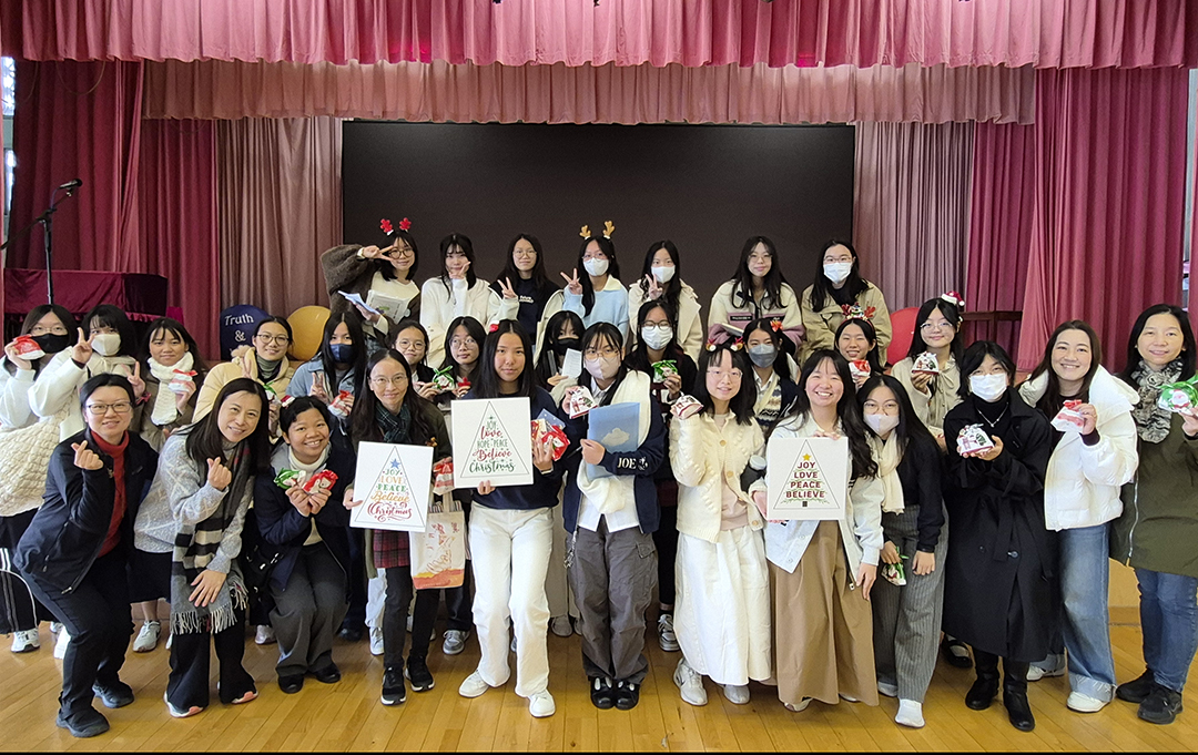 A group of girls wearing masks and standing in front of a statueDescription automatically generated